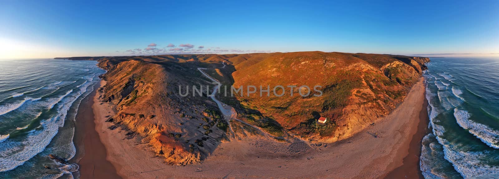 Aerial panorama from the beach at Praia Vale Figueiras in Portug by devy