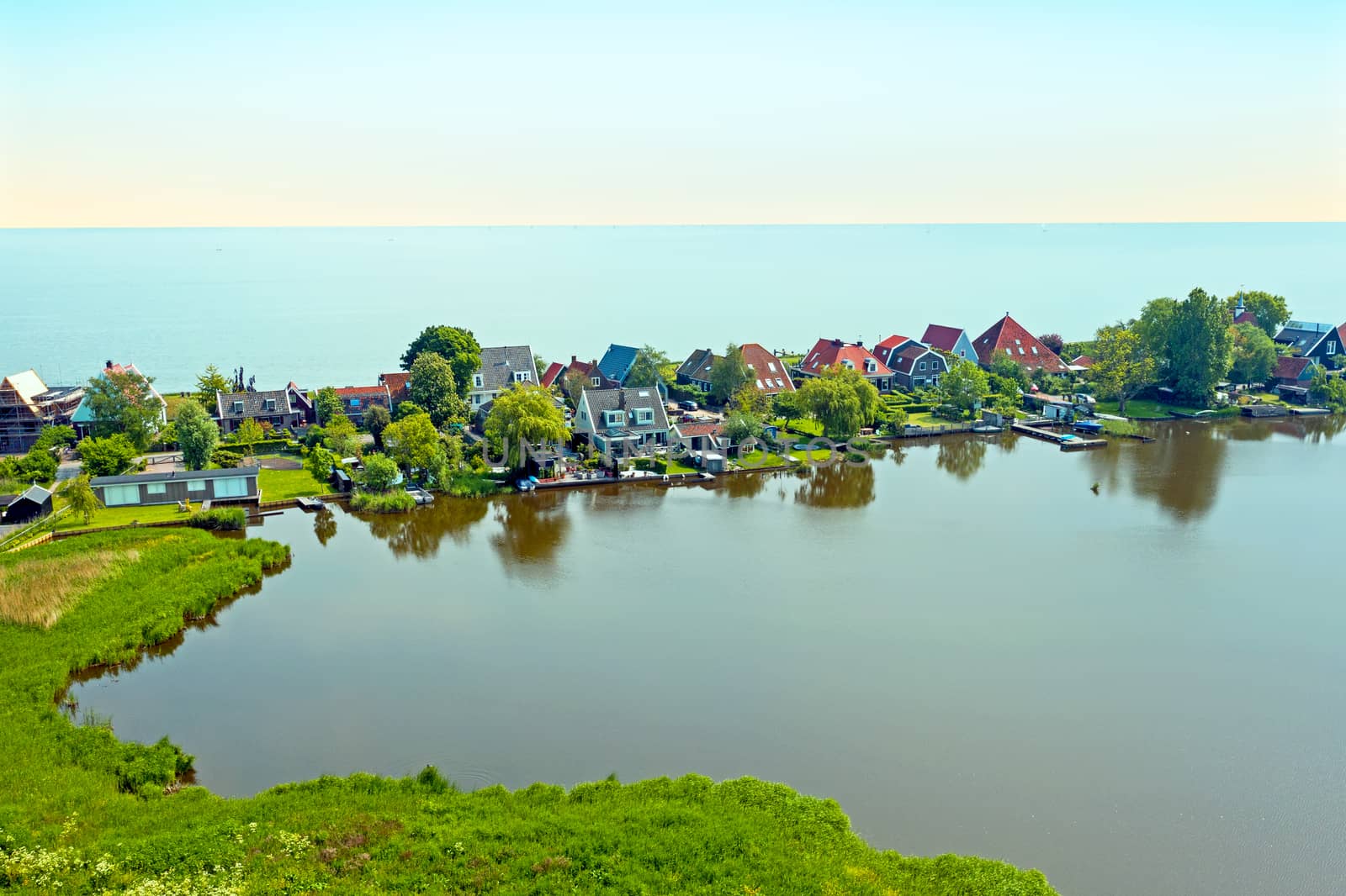 Aerial from the traditional village Uitdam at the IJsselmeer in  by devy