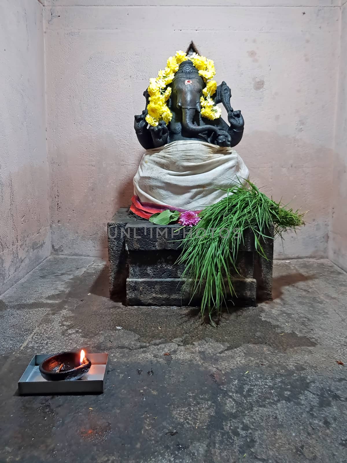 Ancient Ganesha statue in the Ramana Ashram in Tiruvanamalai Ind by devy