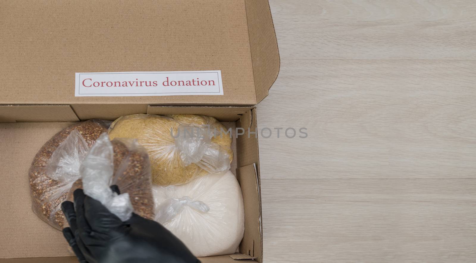 flat lay coronavirus donation box with long term food supplies