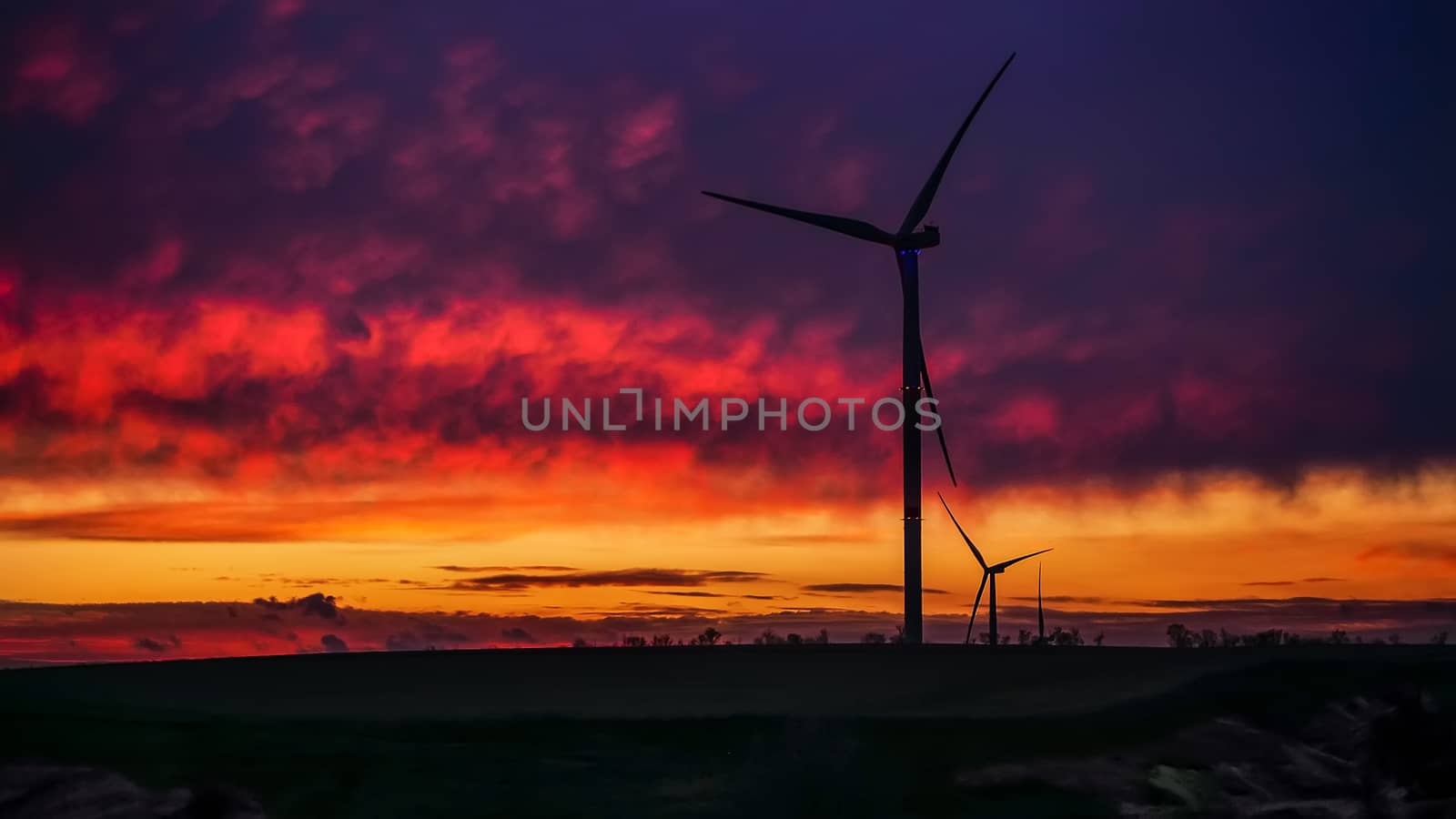 Wind generator triple set on scenic sundown by FoXovsky