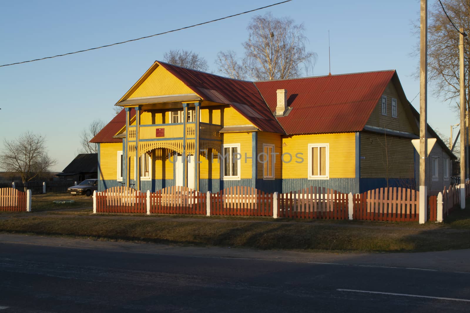 A typical wooden village house in the countryside in spring