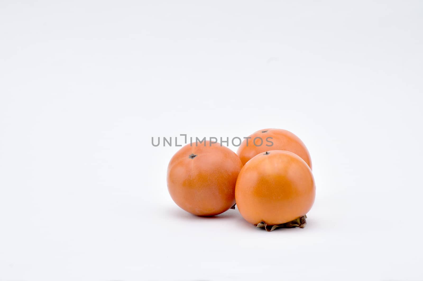 Persimmon on a white background.Natural.For Isolation. by moviephoto