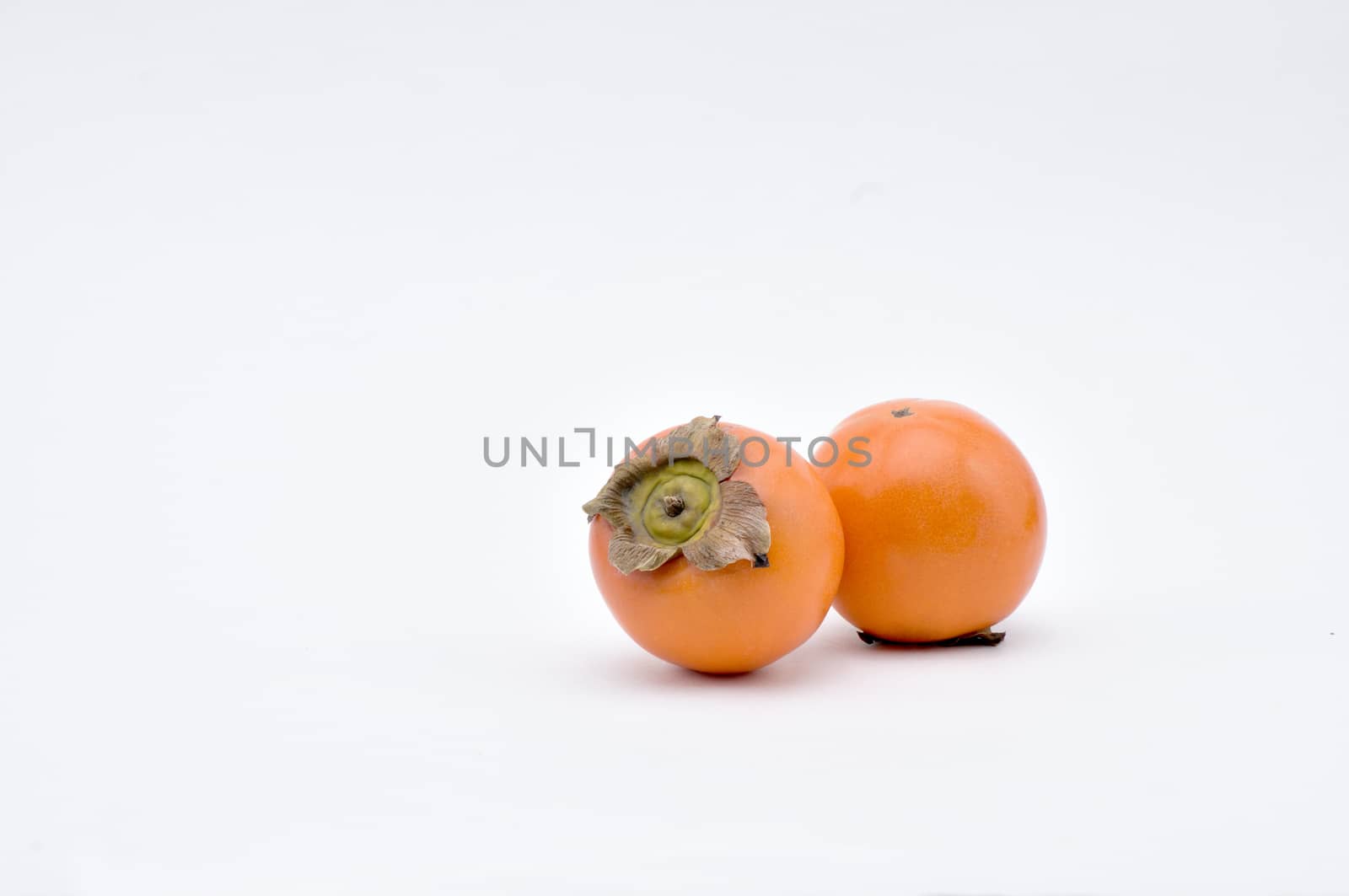 Persimmon on a white background.Natural.For Isolation. by moviephoto