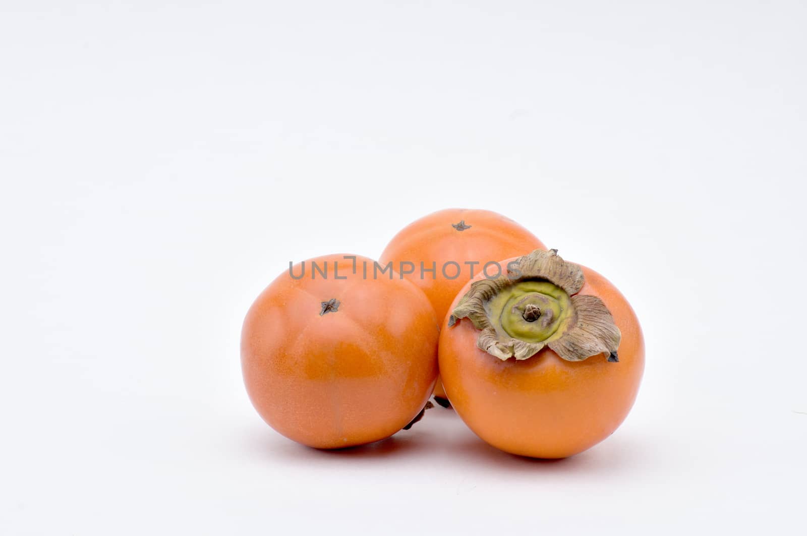 Persimmon,southern fruit of orange-red color,sweet and astringent to taste.
