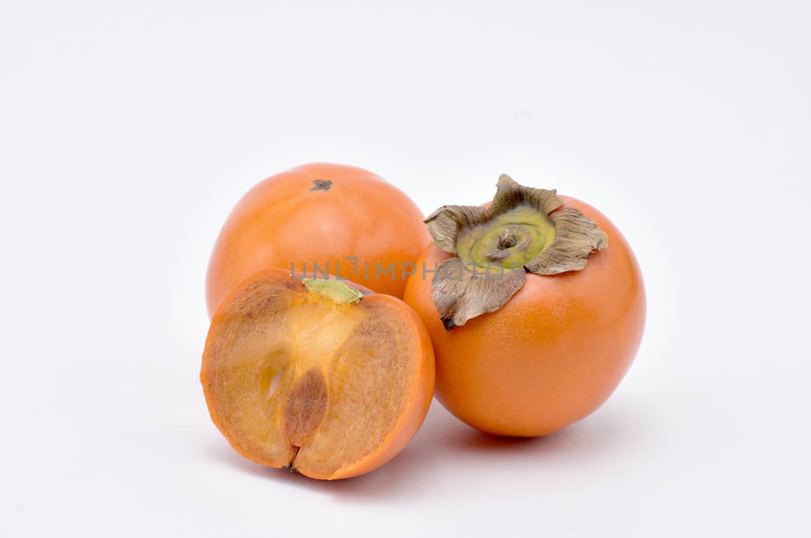 Persimmon on a white background.Natural.For Isolation. by moviephoto