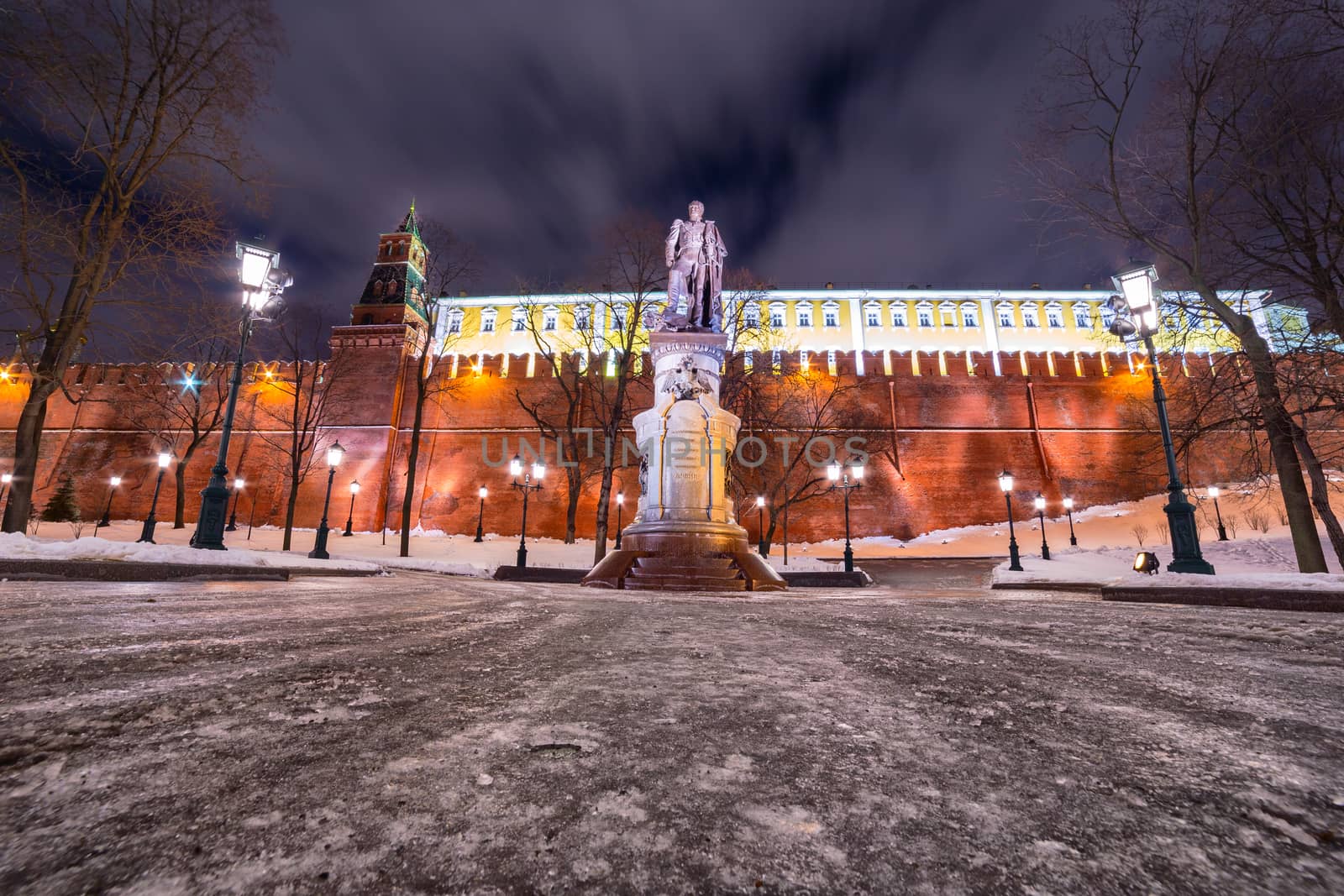 Monument to Emperor Alexander I in Moscow with Kremlin wall behind during winter night