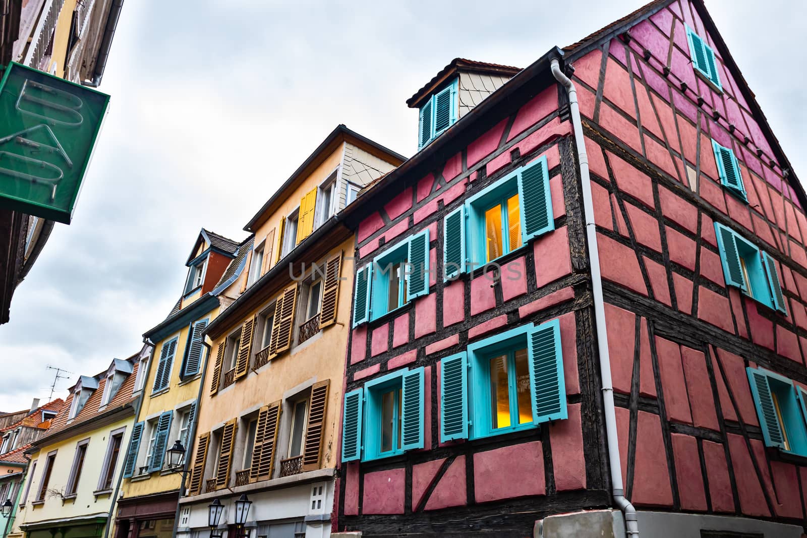 Old town of Colmar, Alsace, France. View with colorful buildings, streets, canal and flowers.  Petite Venice, traditional half timbered houses.