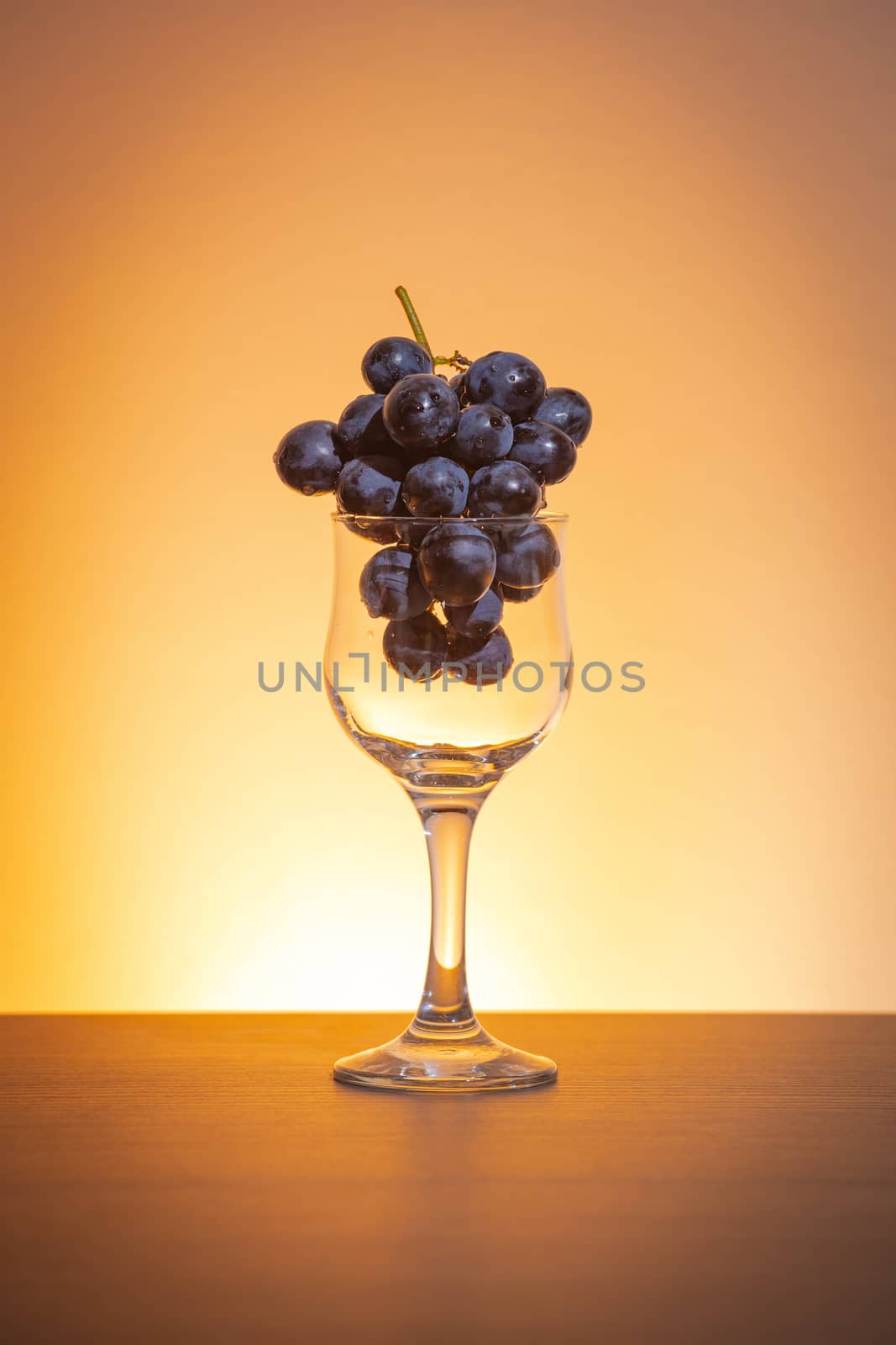 Grapes in wine glass concept by marugod83