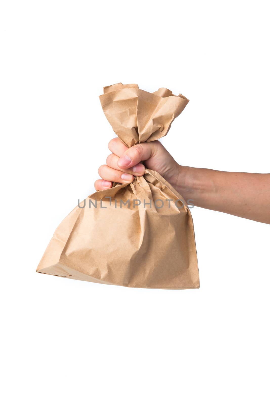 Man holding a brown paper bag isolated on white