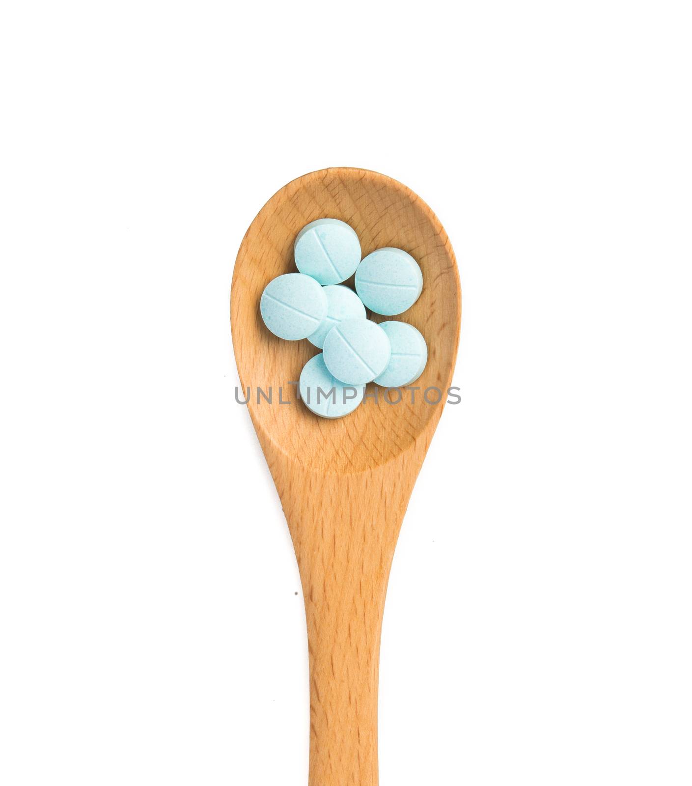  pills in wooden spoon by tehcheesiong