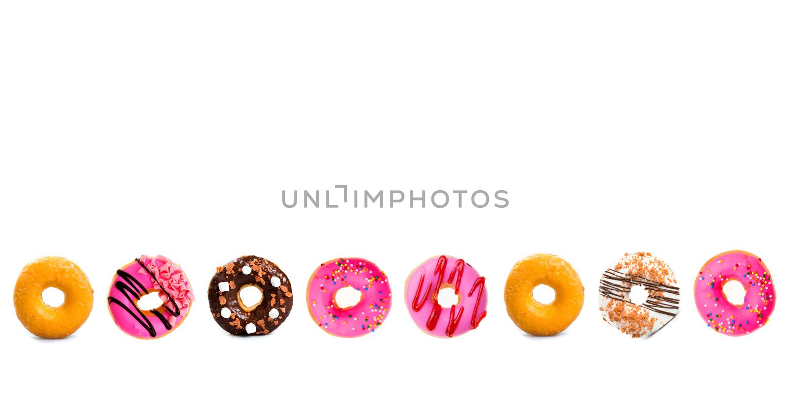 various doughnuts on white background