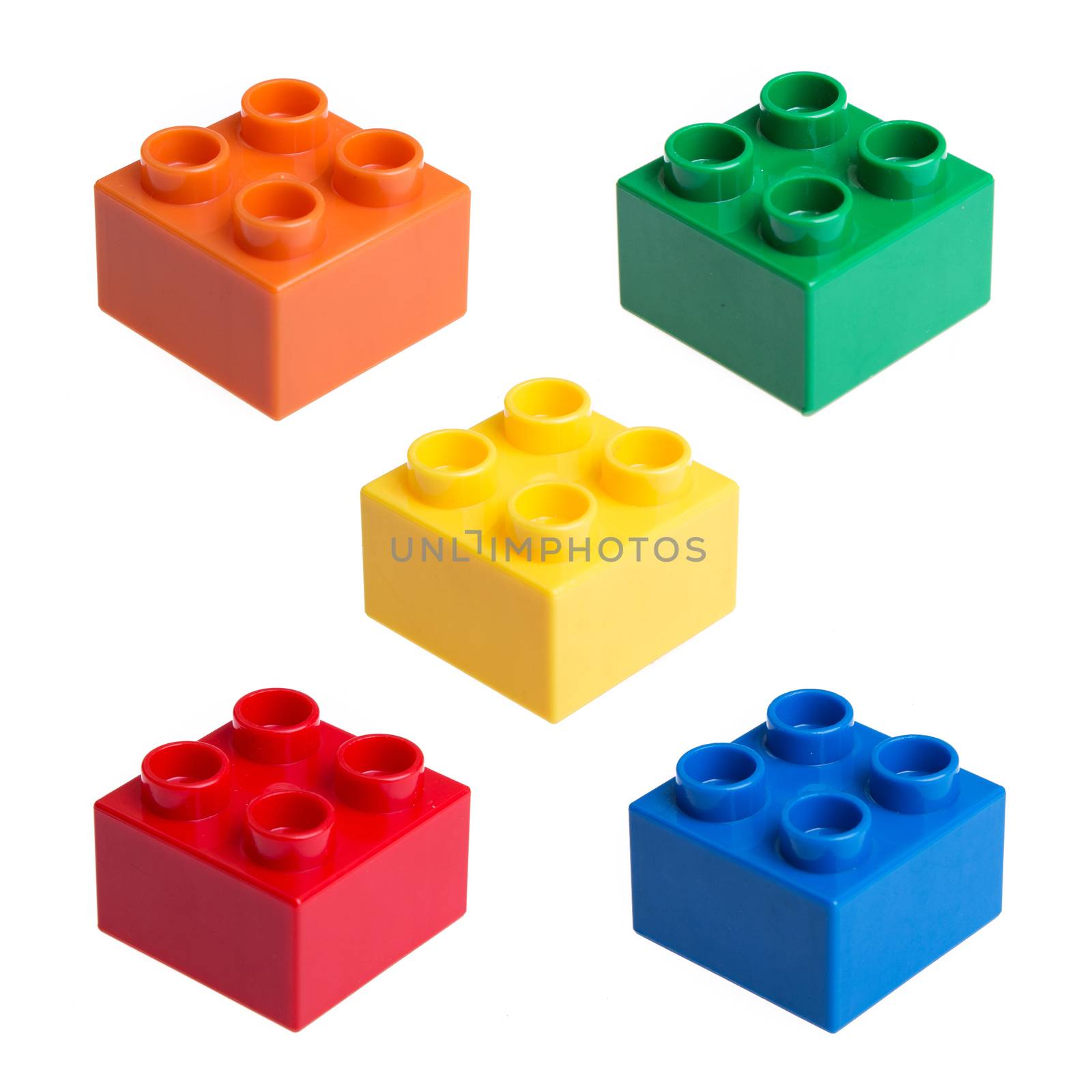 colorful plastic block on white background by tehcheesiong