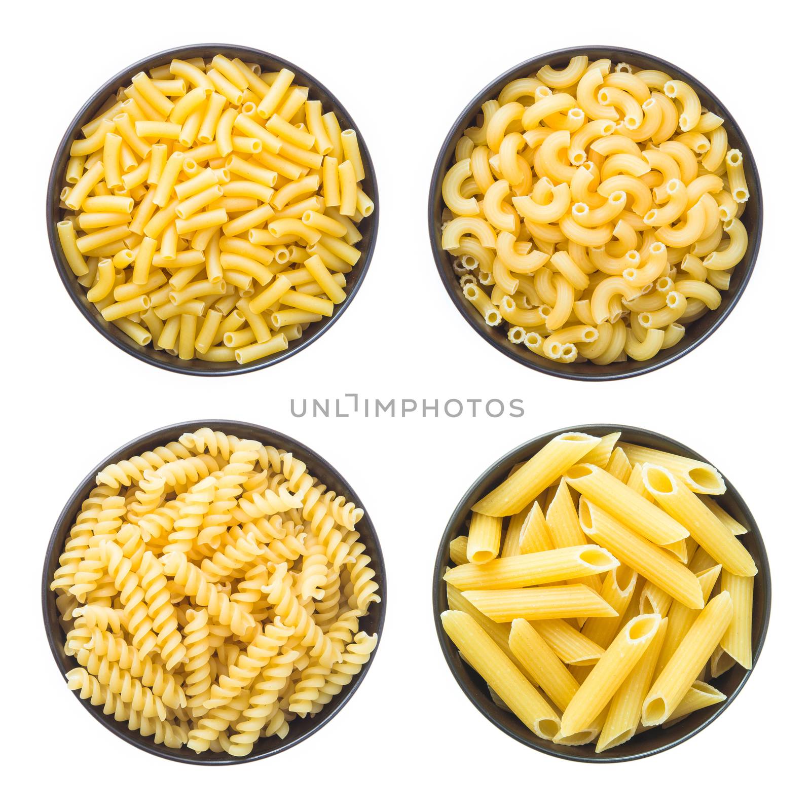 raw macaroni isolated on white background by tehcheesiong