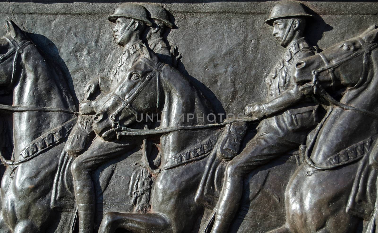 Detail of the bronze frieze of World War I soldiers riding their horses on the Cavalry Monument dedicated to those killed fighting.  Sculpted in 1921 by Adrian Jones an on public display in Hyde Park, London.
