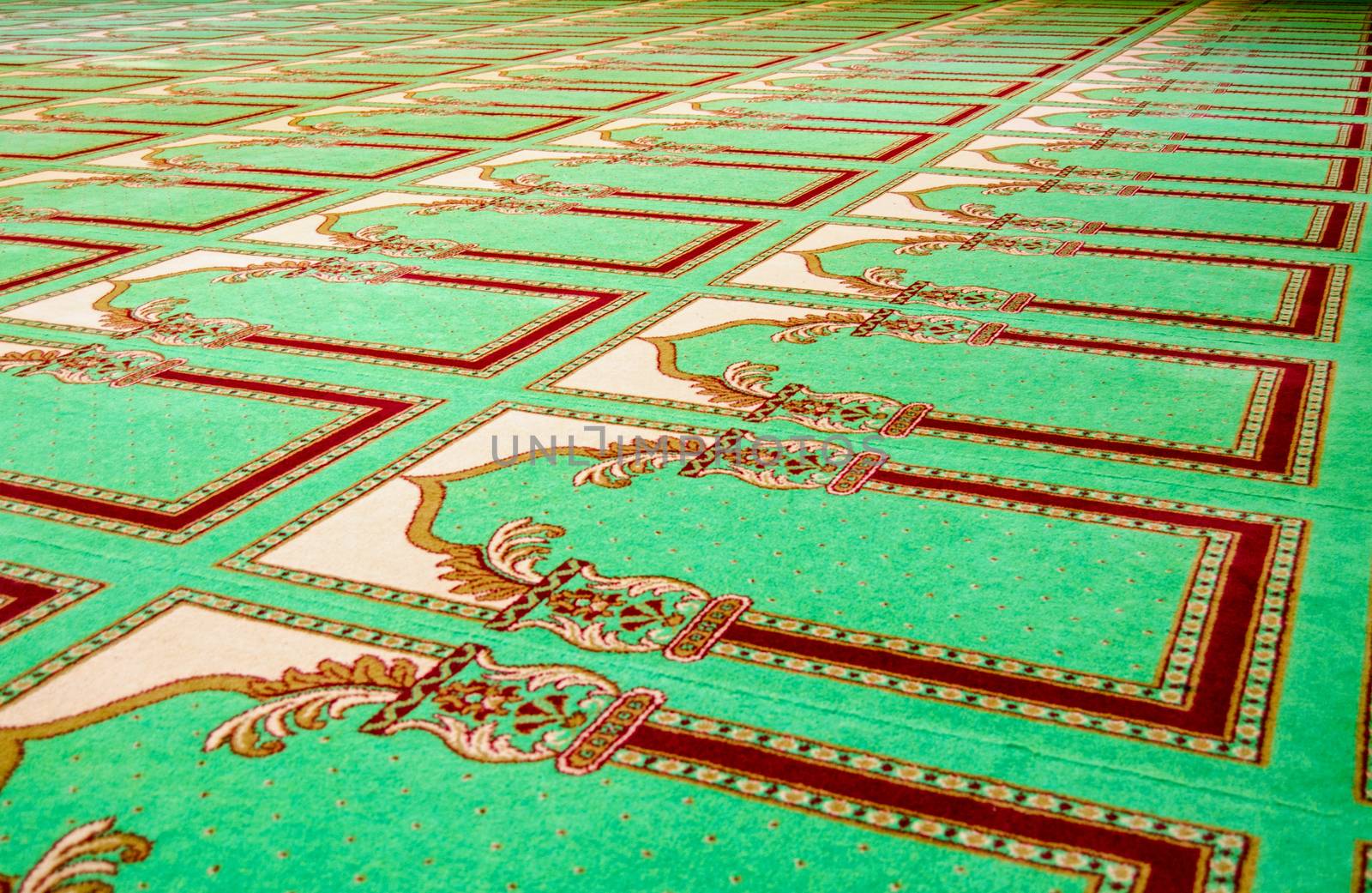 Prayer carpet in a mosque by BasPhoto