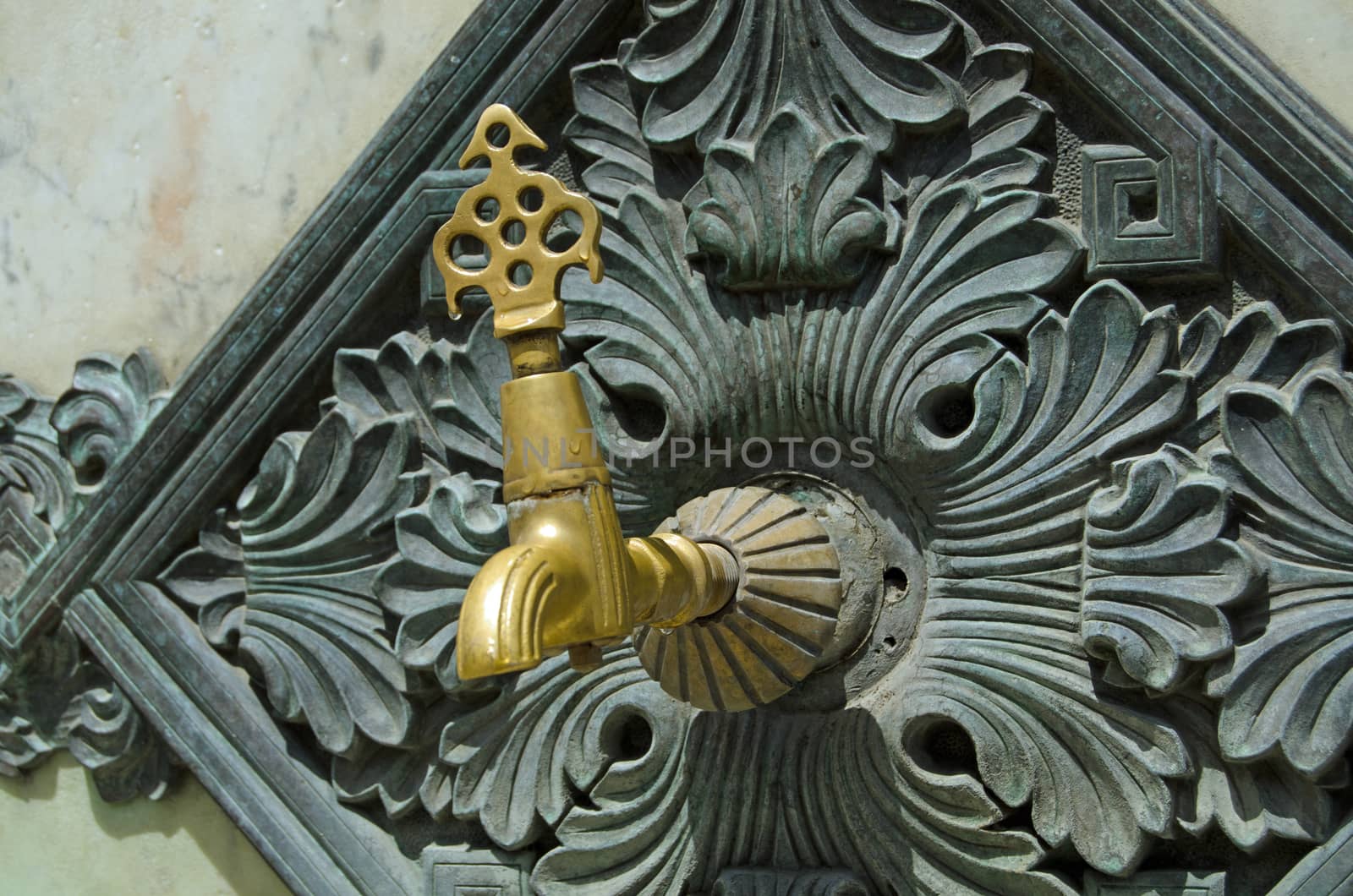 Detail of one of the taps providing water at the landmark German Fountain in the Sultanhamet district of Istanbul.  The monument was erected to mark German - Ottoman relations in 1898 and has been in public use since.