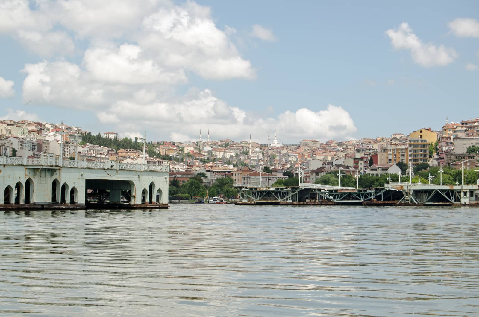 View of the bridge over the Golden Horn in Istanbul which has been dismantled as it was too low for some ships to pass under.  Looking from the southern shore towards the Beyoglu district of the city.