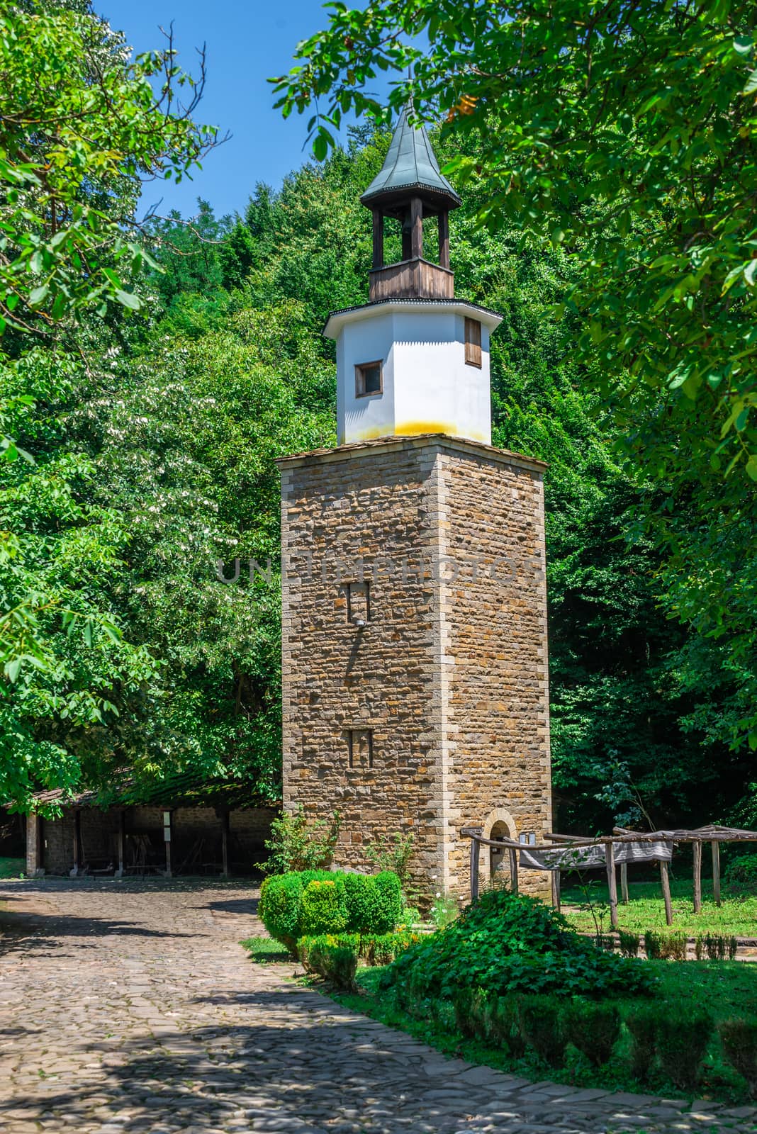 Clock tower in the Etar Architectural Ethnographic Complex in Bulgaria on a sunny summer day