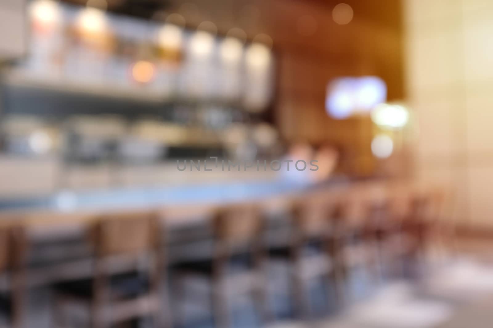 Abstract blur background of hipster cafe or restaurant interior with sunlight, for montage and mockup background