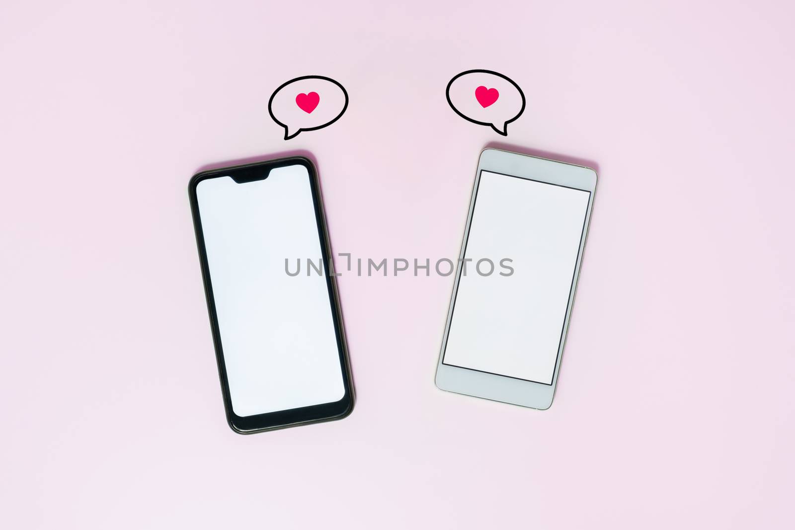 Phones on pink background with love text messages by photoboyko