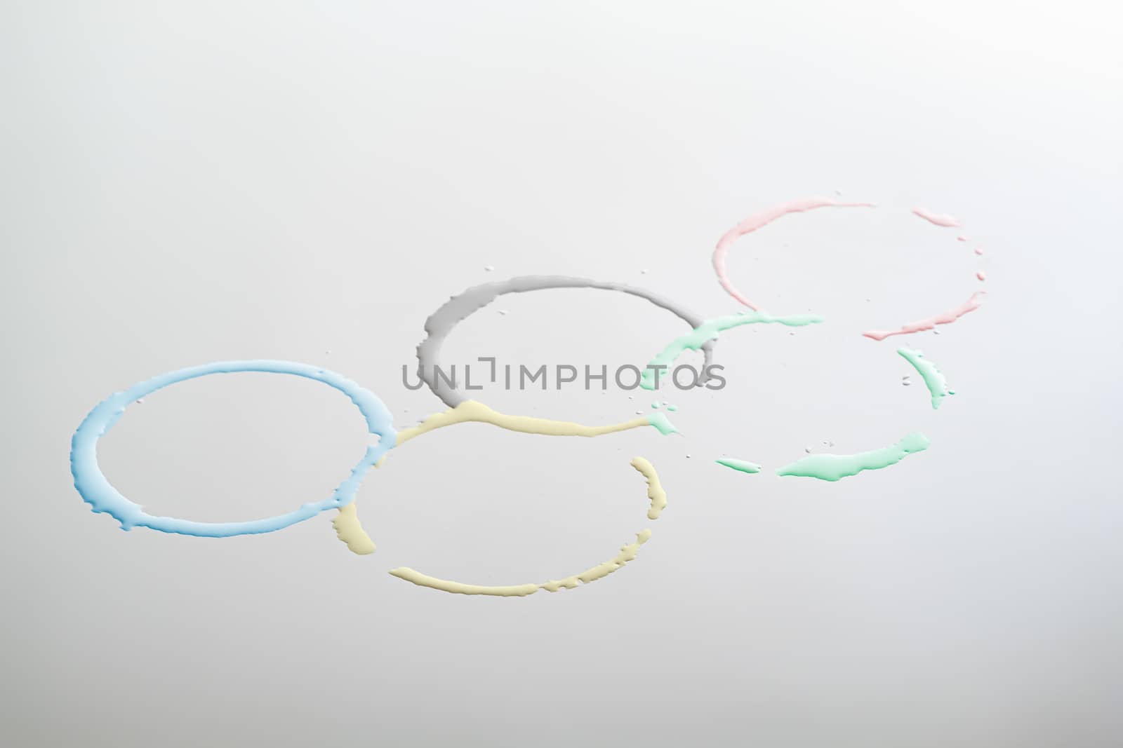 The Olympic Games sign in the form of colored water circles. Concept of sports, competition or water sports at the olympic games