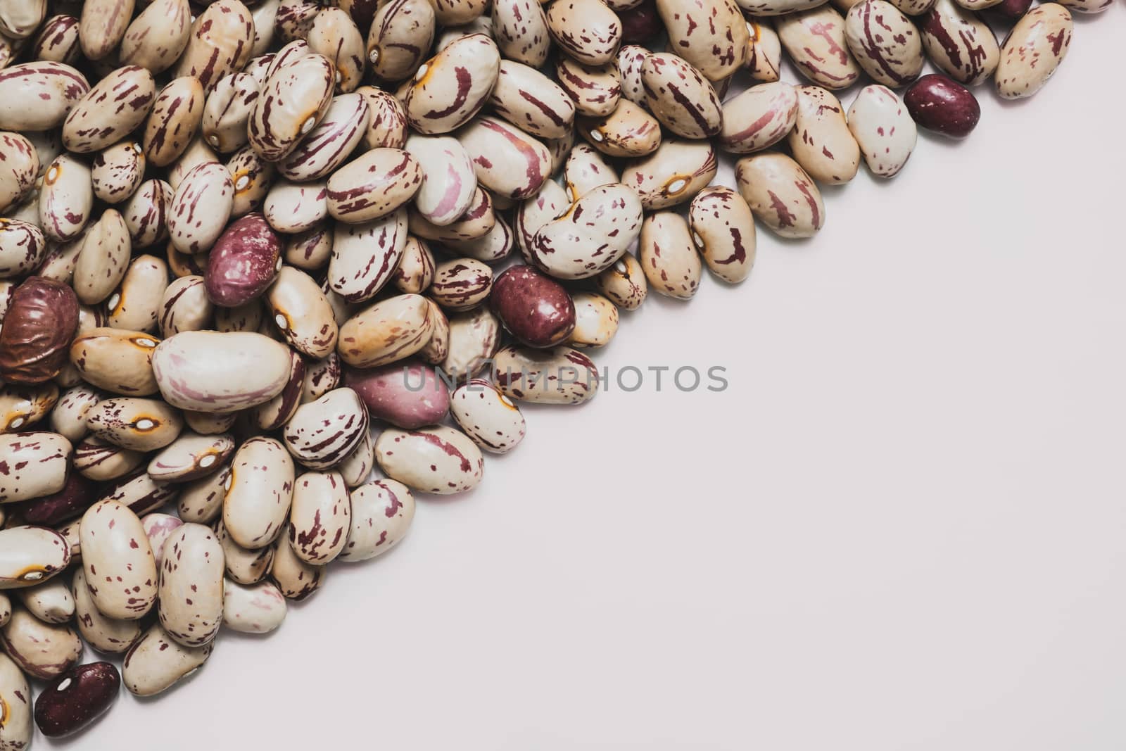 Heap of beans on clean background. by photoboyko