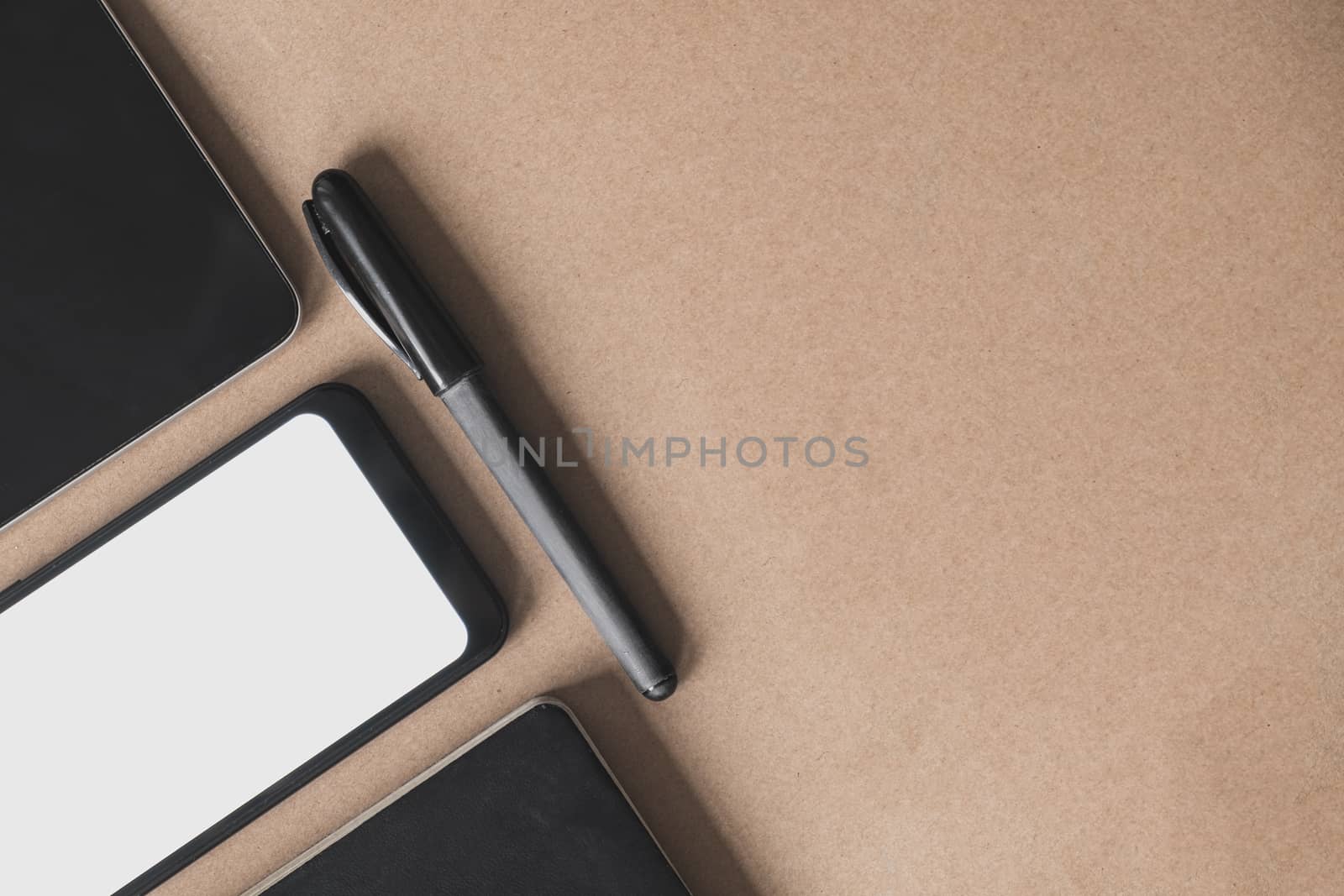 Business flat lay on brown paper background. by photoboyko