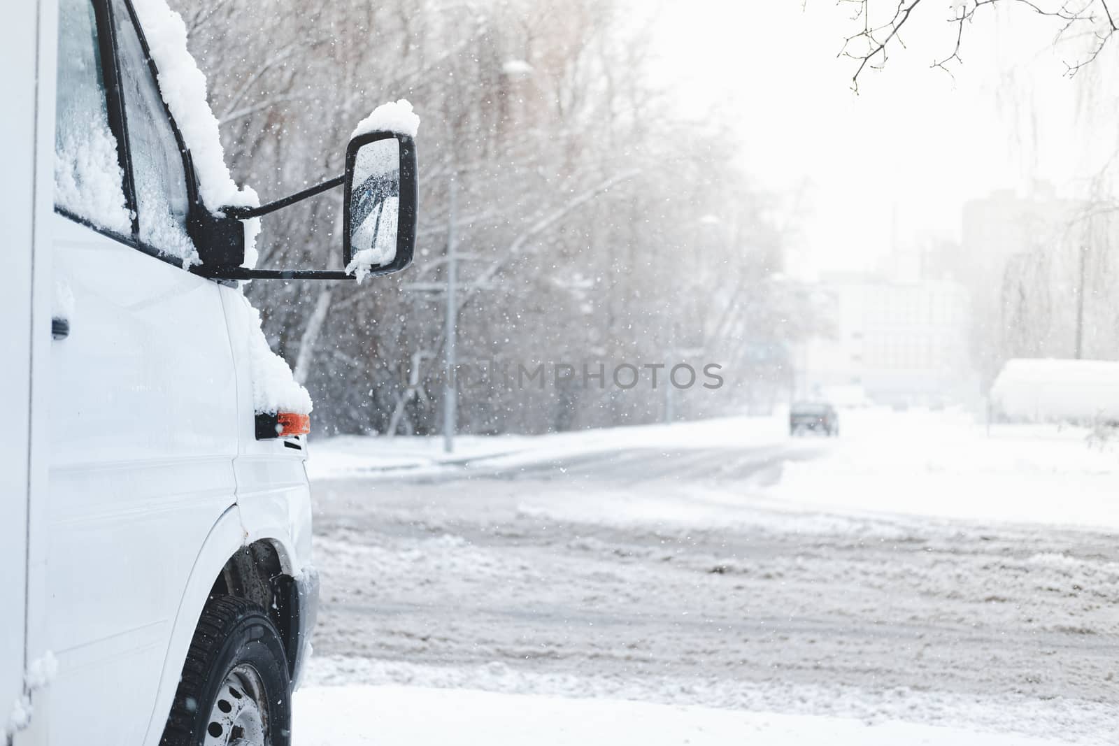 The front part of a car covered in snow. by photoboyko