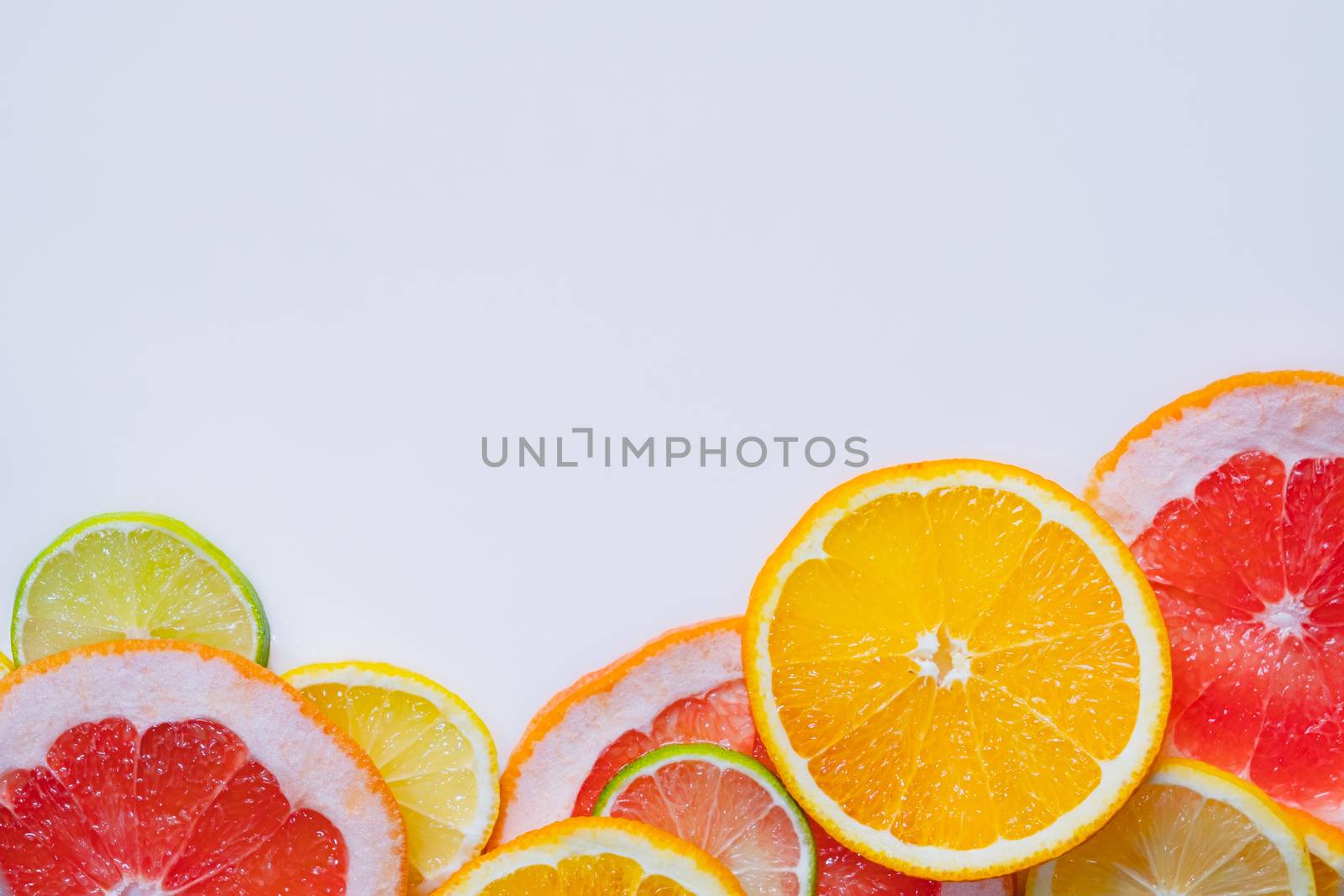 Fresh juicy citrus fruit background with copy space by photoboyko