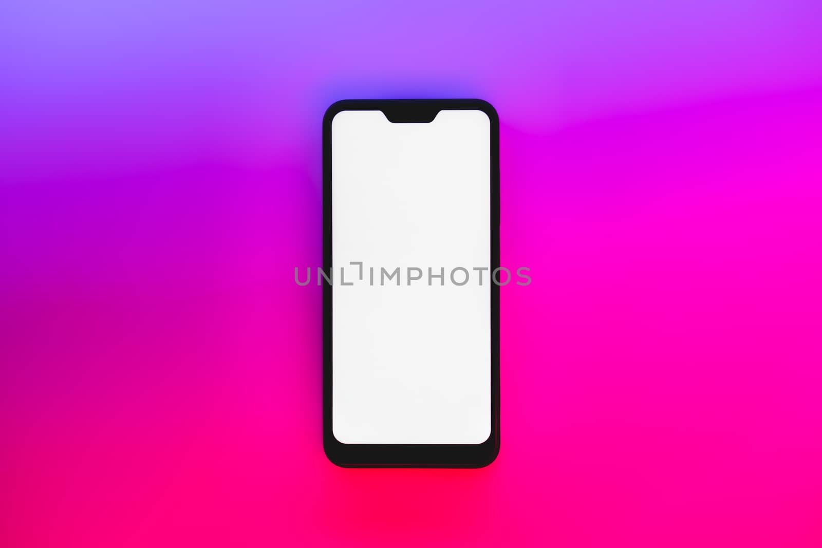 Modern generic smartphone in neon backdrop. by photoboyko