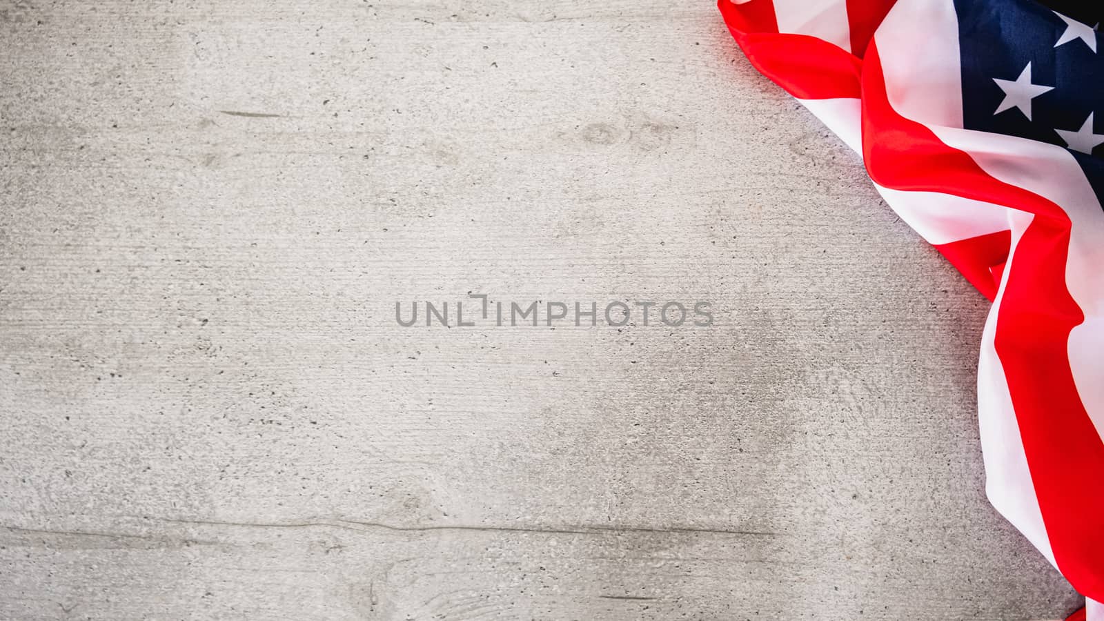 Grey wood background with USA flag in the corner. by photoboyko