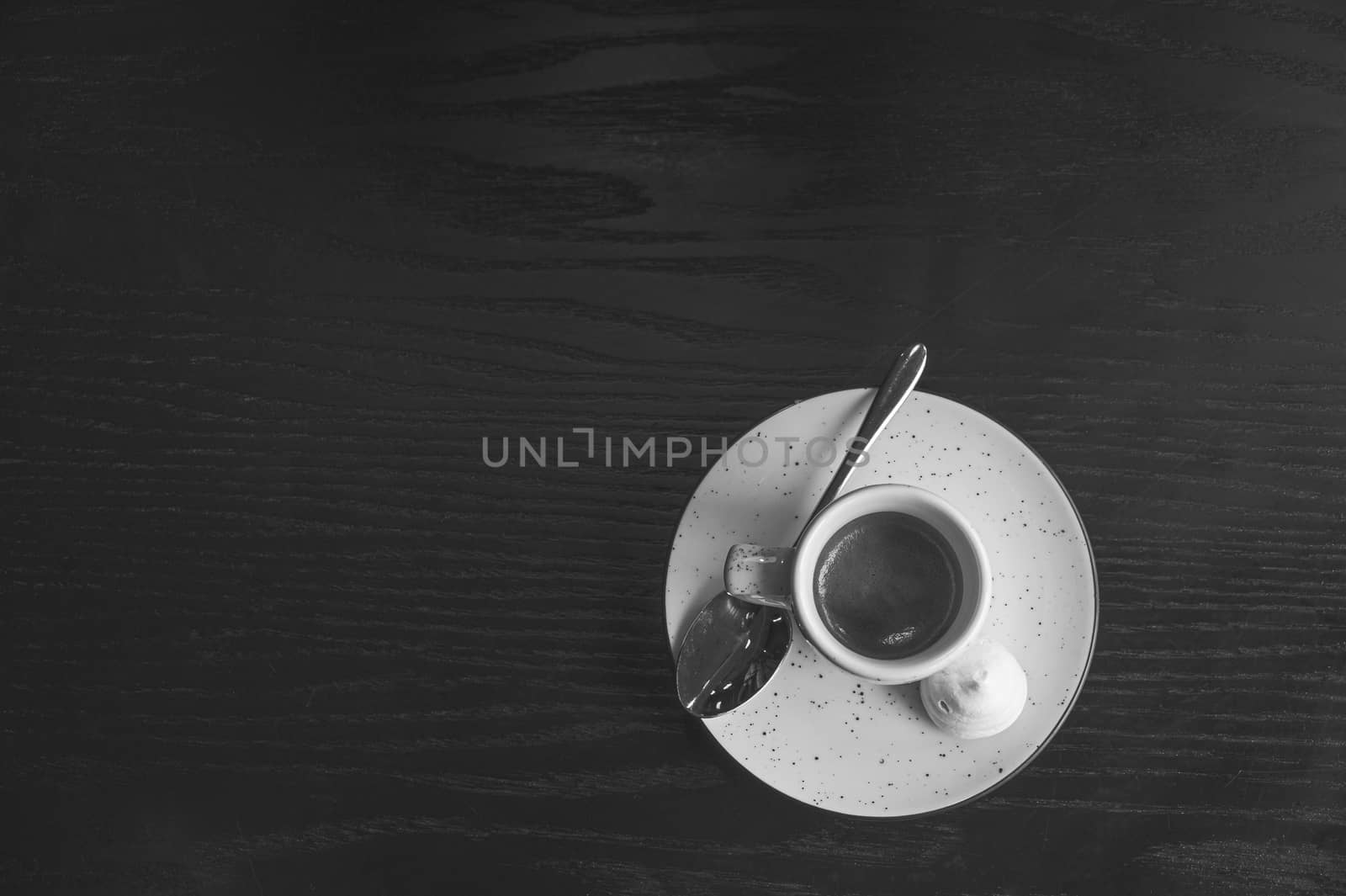 faded monochrome picture of a cup of espresso. by photoboyko