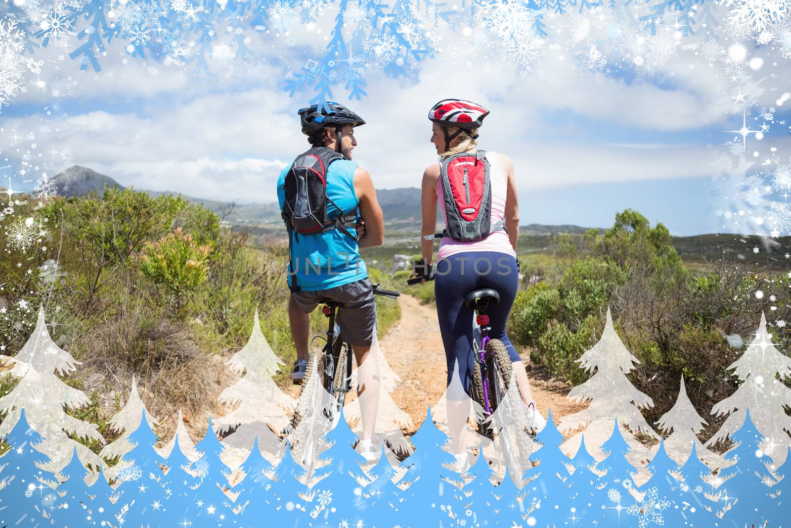 Fit couple about to cycle on mountain trail by Wavebreakmedia