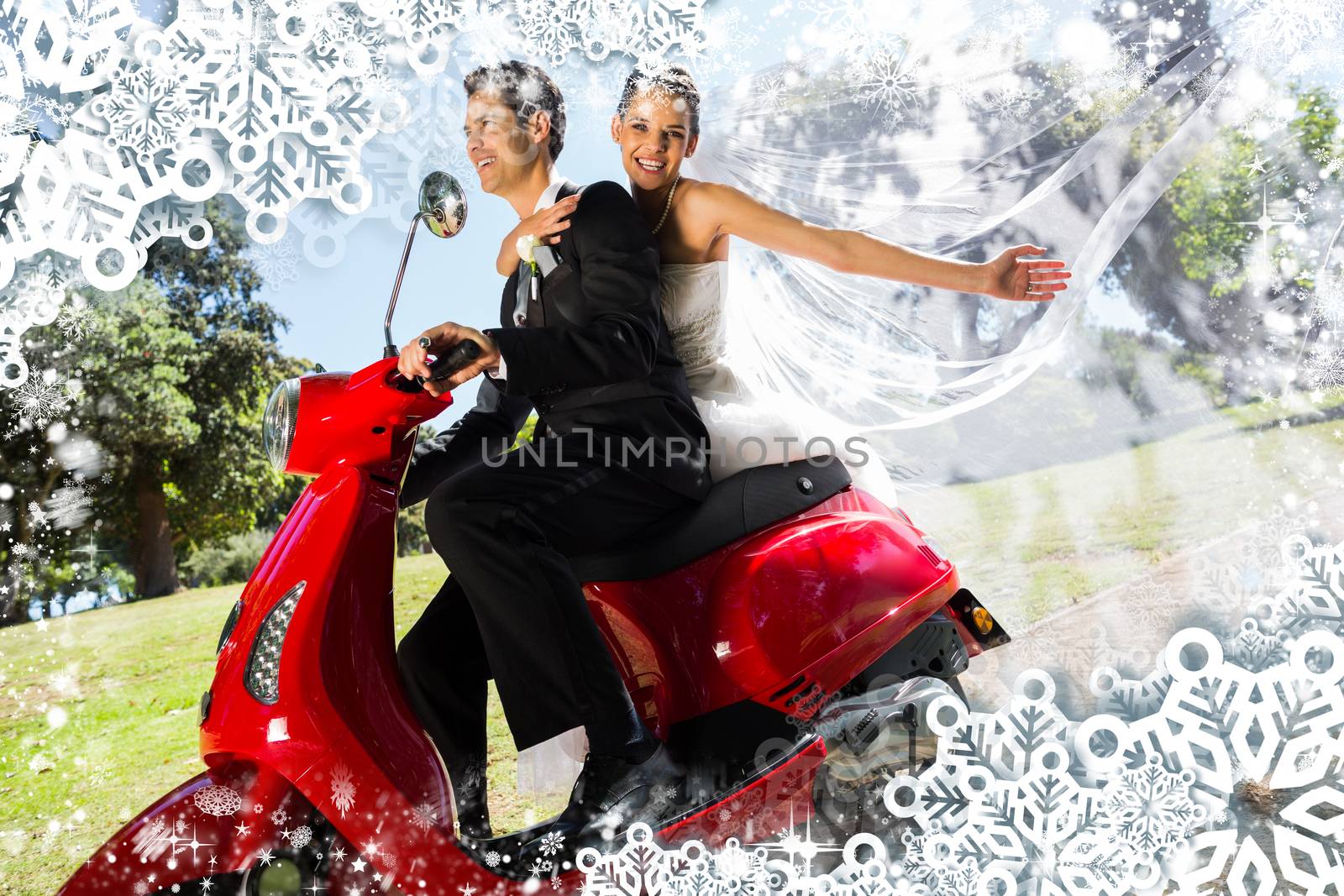Newlywed couple enjoying scooter ride against snow