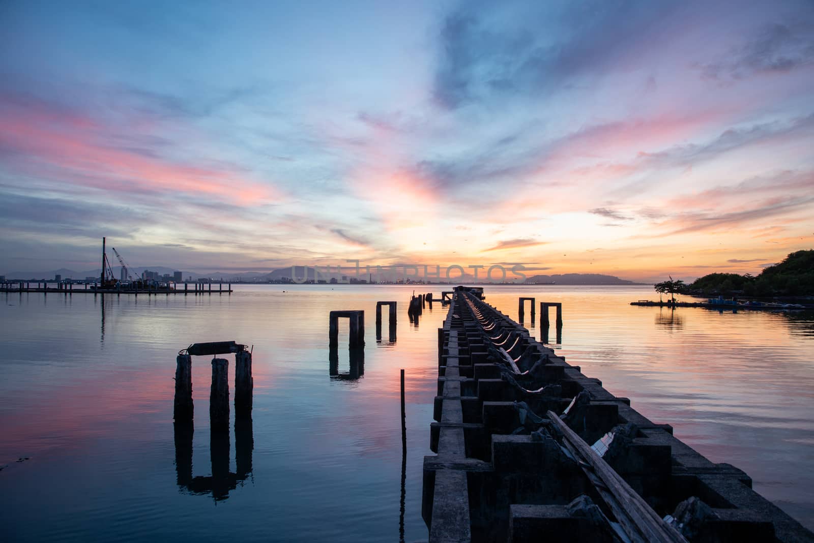 Sunrise broken bridge of fisherman jetty at Karpal Singh Drive, Penang, Malaysia.