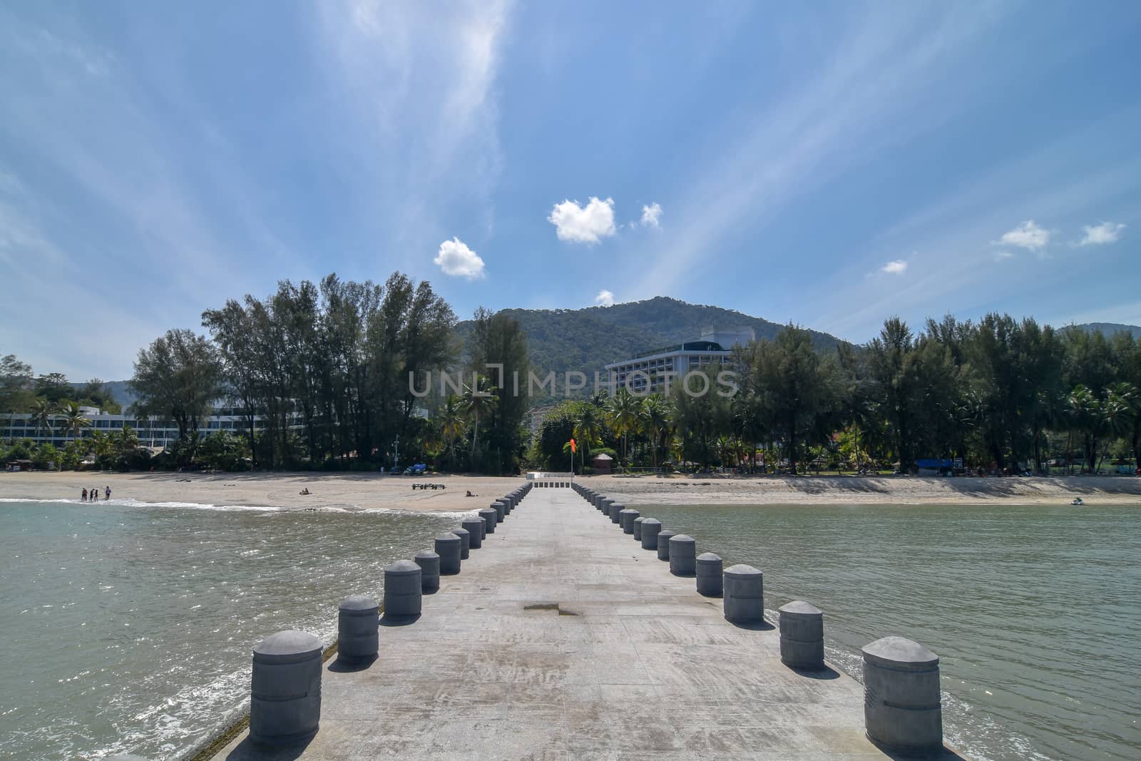 Bridge at Batu Ferringhi in afternoon. Background is Bayview Beach Resort.