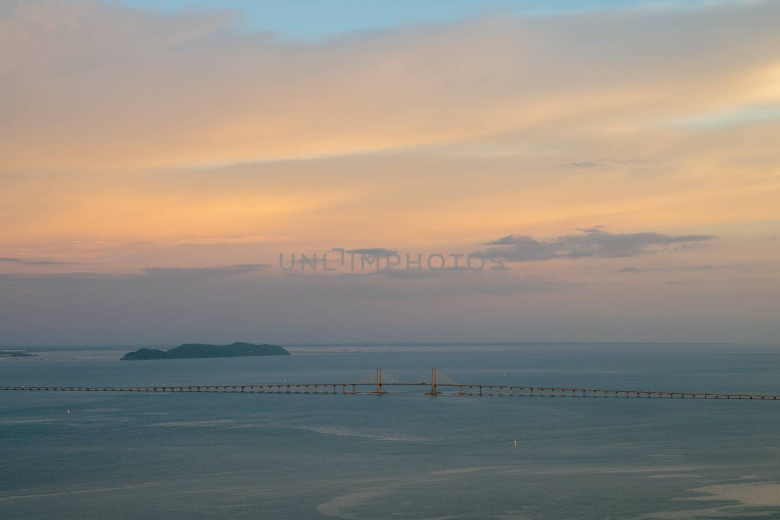 Aerial view Penang Bridge in sunset evening.