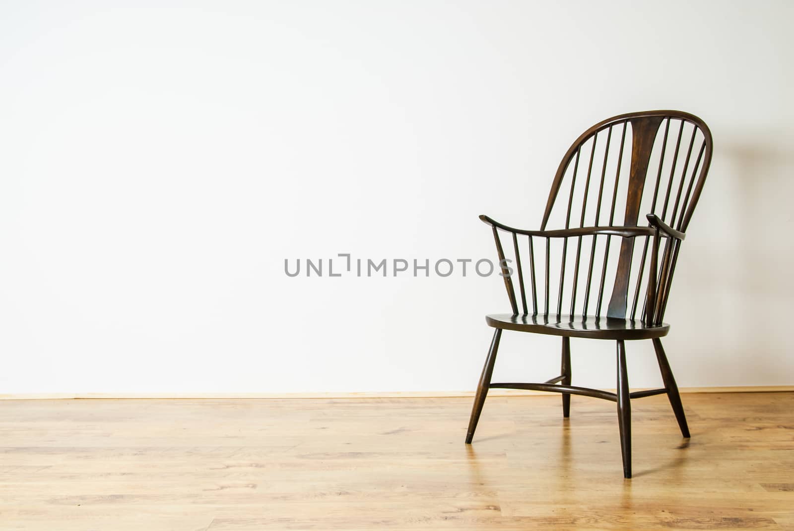 Single Windsor style chair in empty room by paddythegolfer