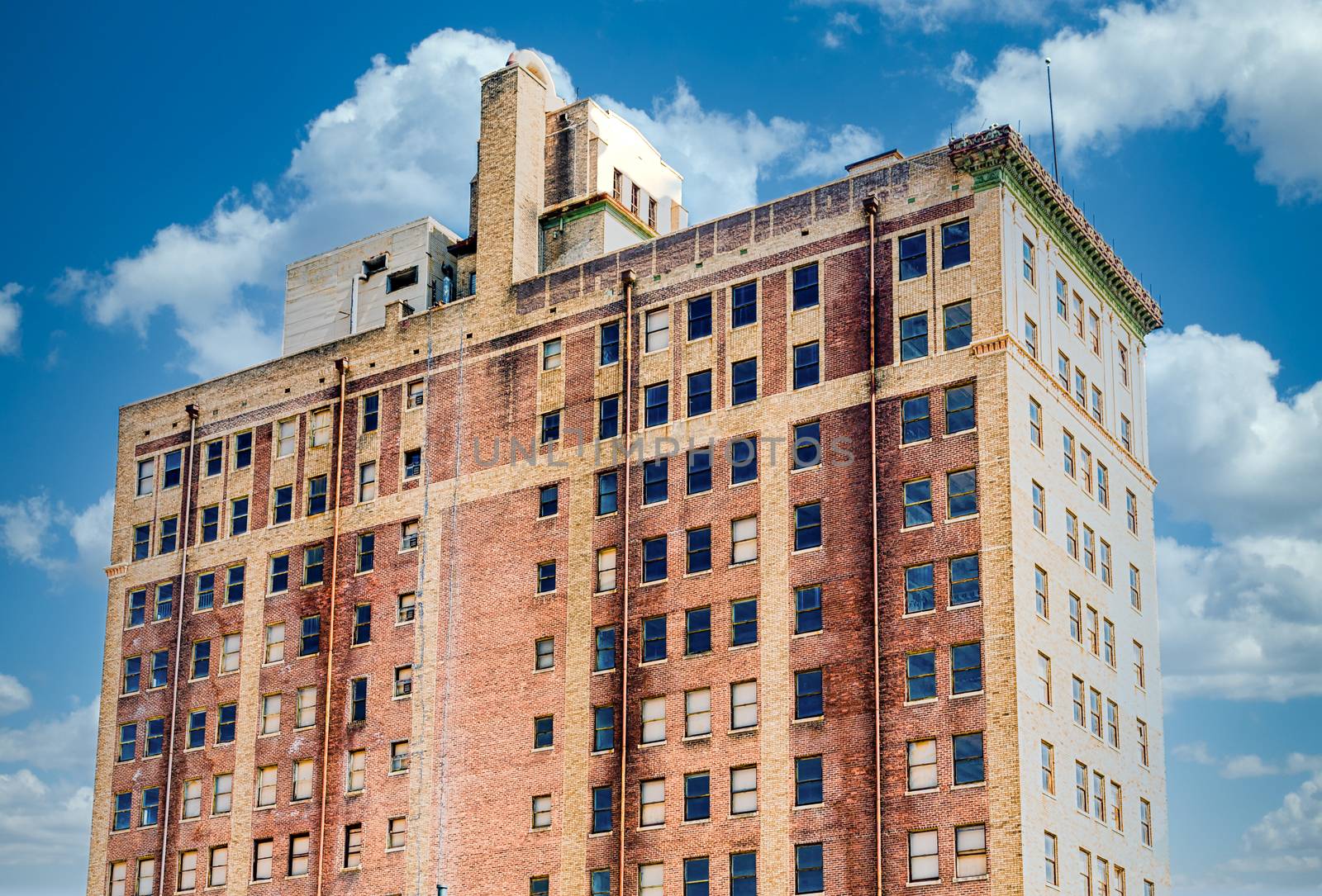 An old brick hotel in an urban setting