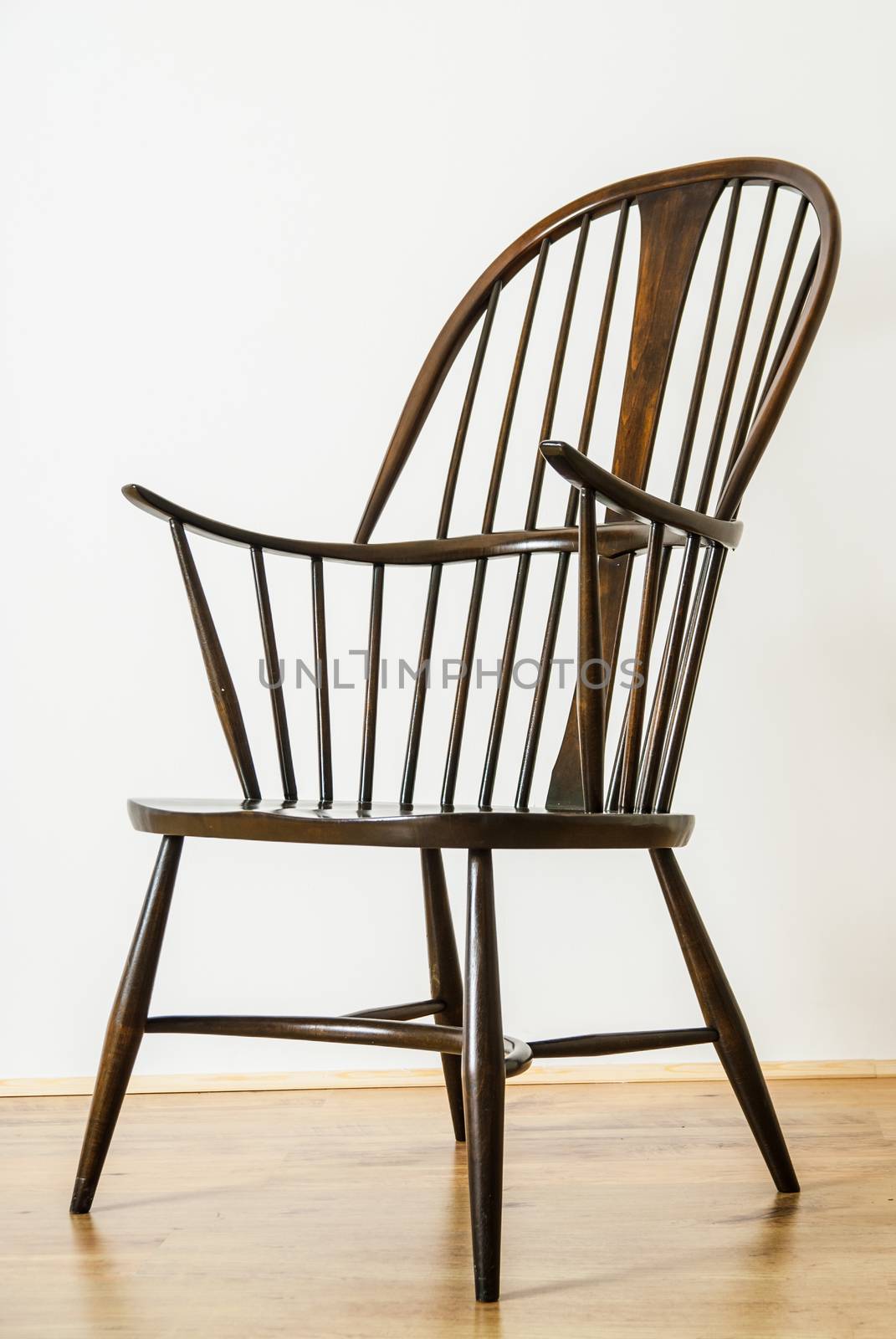 Single Windsor style chair in empty room by paddythegolfer