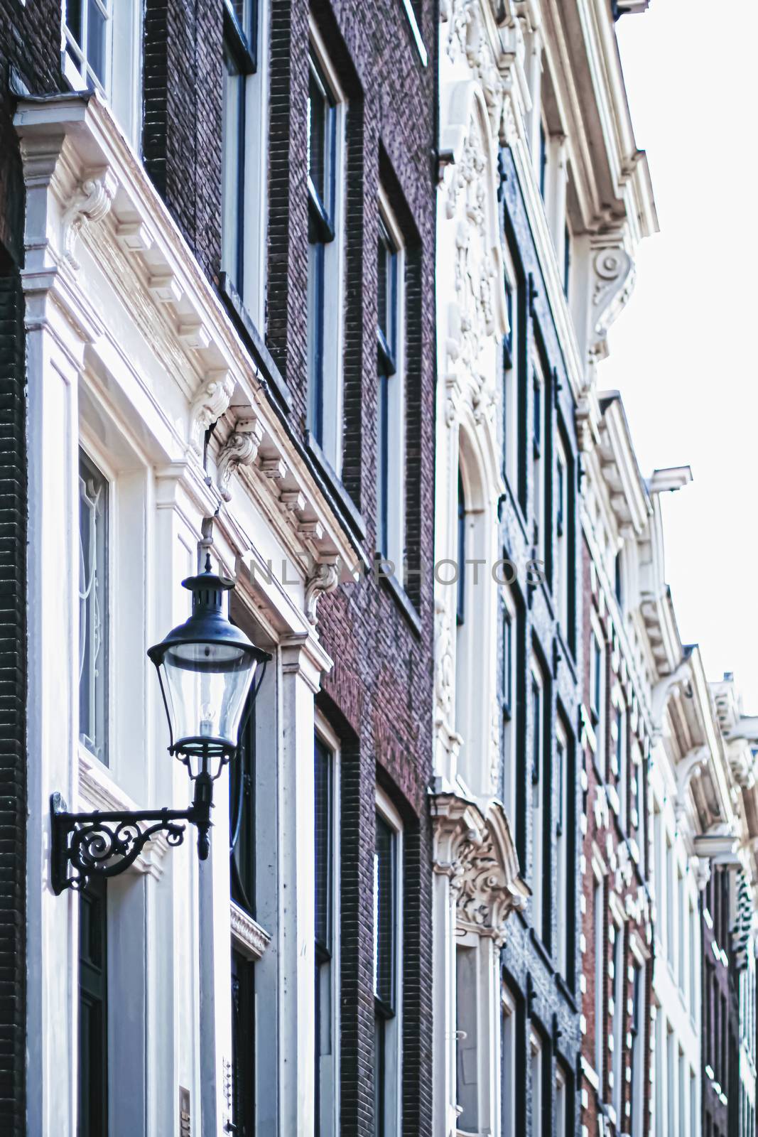 Architectural detail of a building on the main city center street of Amsterdam in Netherlands by Anneleven