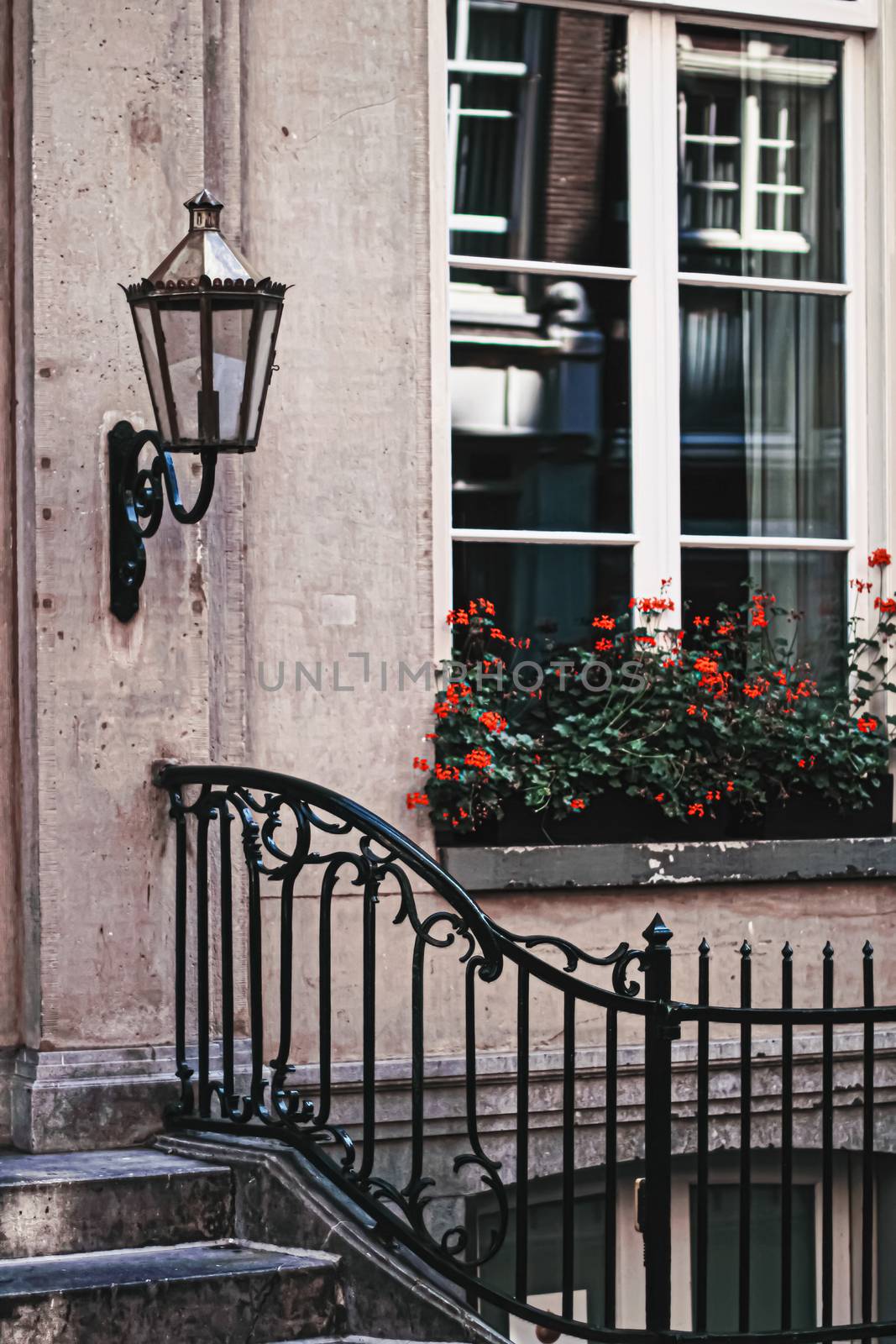 Architectural detail of a building on the main city center street of Amsterdam in Netherlands by Anneleven