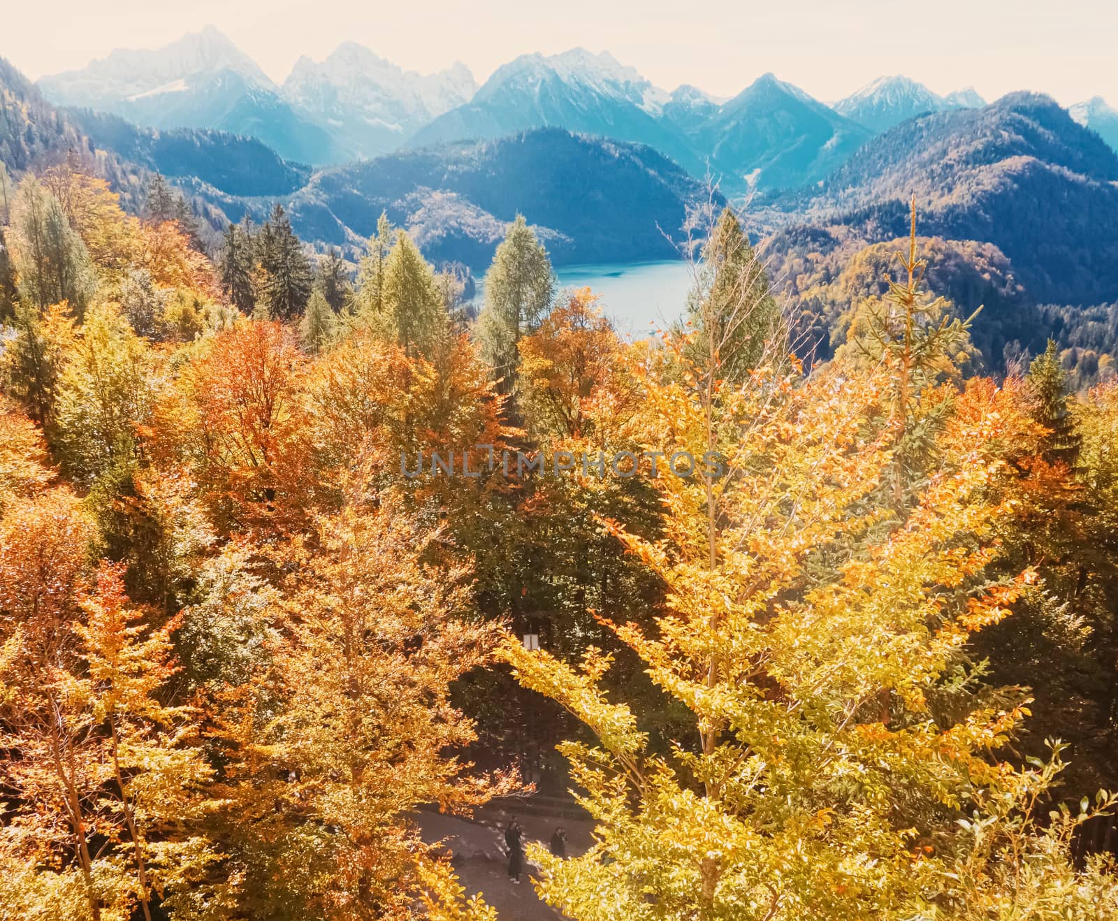 Beautiful nature of European Alps, landscape view of alpine mountains, lake and village in autumn season, travel and destination scenery