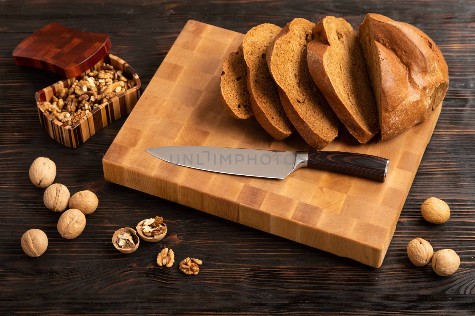 A loaf of bread sliced into slices with a knife by sveter