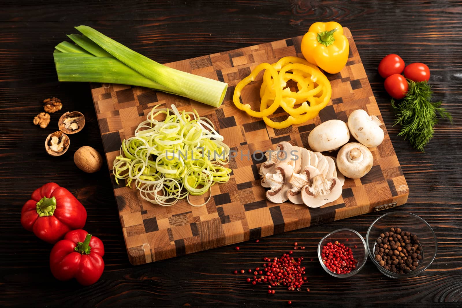 vegetables and spices on a wooden cutting board by sveter