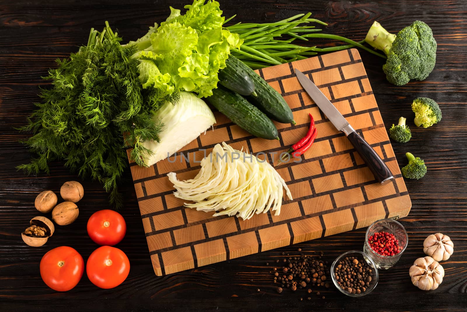 vegetables and spices on a wooden cutting board by sveter