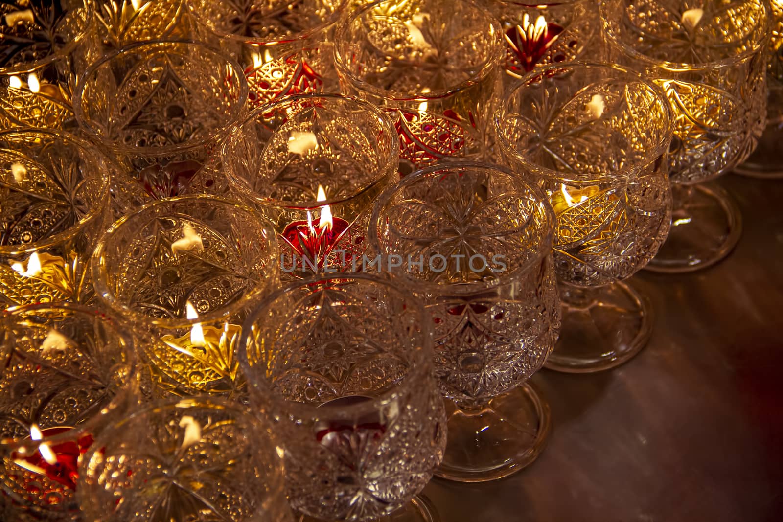 Candle lights in glass at Chinese temple