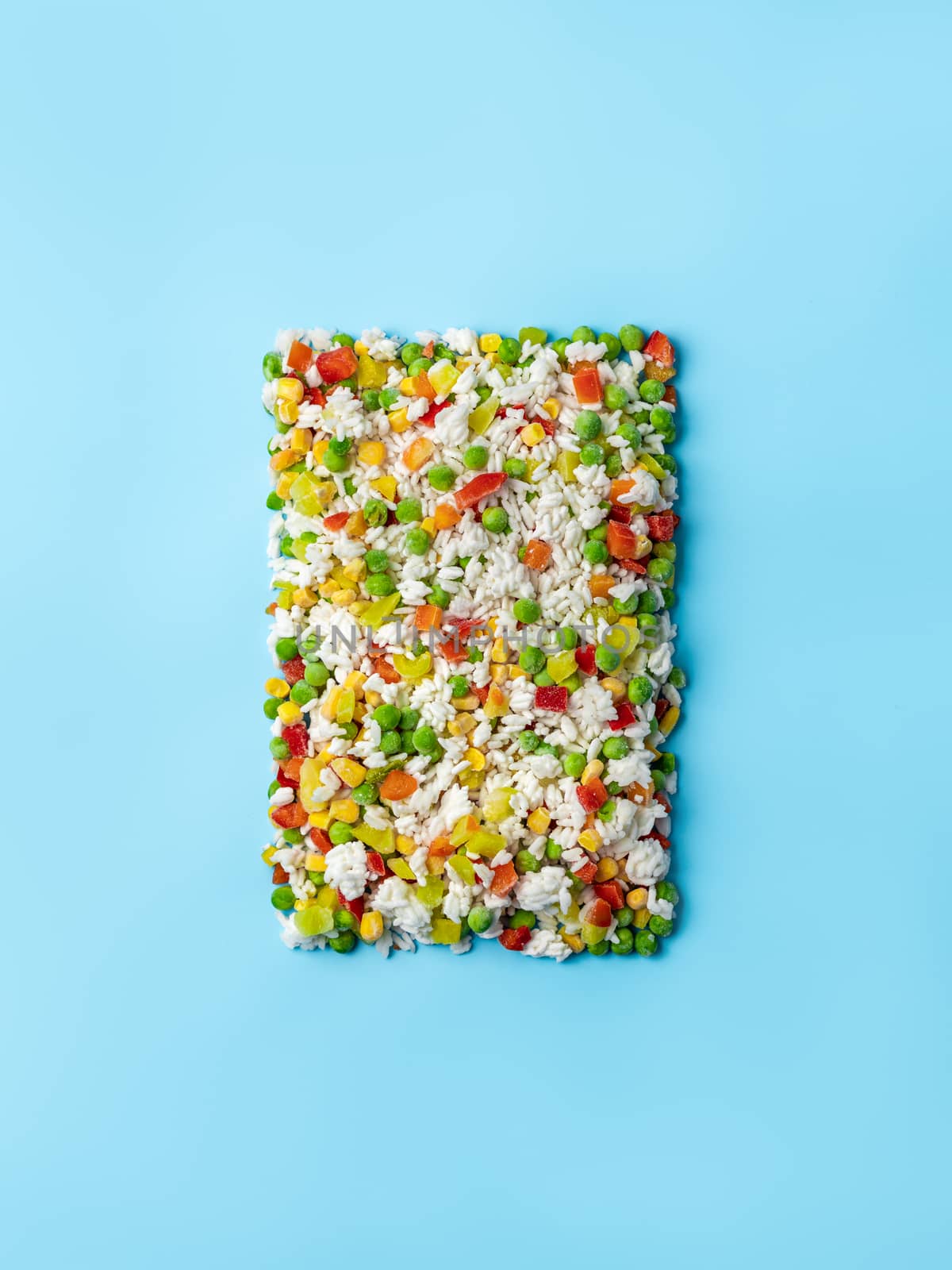 Frozen vegetables assorted on blue, top view by fascinadora