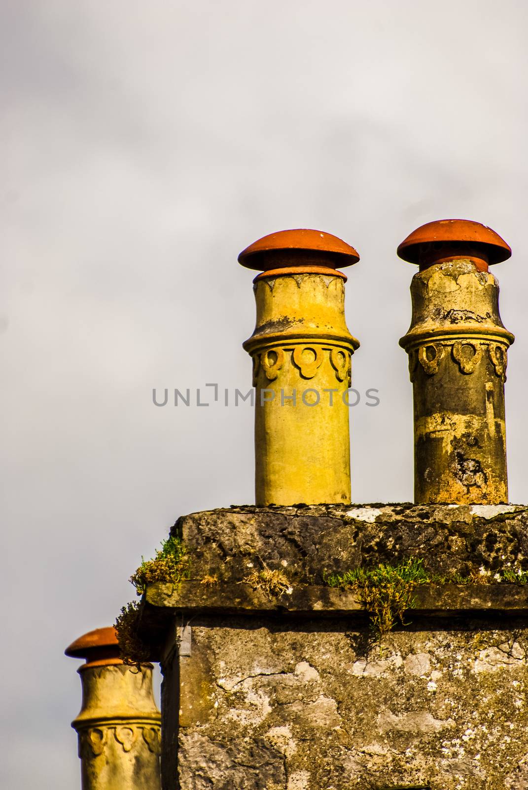 Two Large Ornamental Brick Chimneys on a House. UK